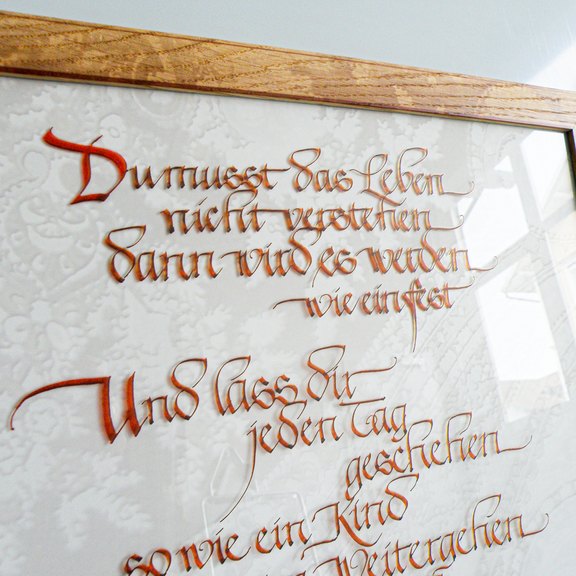 Kalligraphischer Spruch als Dekorelement Bild mit Rahmen